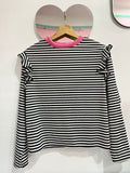 Polera rosita rayas blanco y negro.